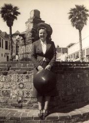 [ Mary, holding her sun hat, on her honeymoon in Avalon, Catalina Island, by the fountain, 24 June, 1937 ]